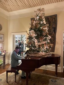 Chris playing holiday tunes on Steinway piano at Monroe